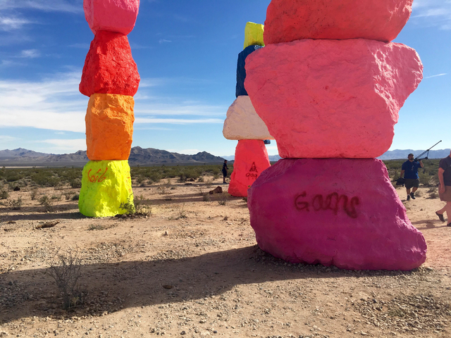 People walk through the Seven Magic Mountains art project off Interstate 15 on Sunday, June 5, 2016.  (Natalie Bruzda/Las Vegas Review-Journal)