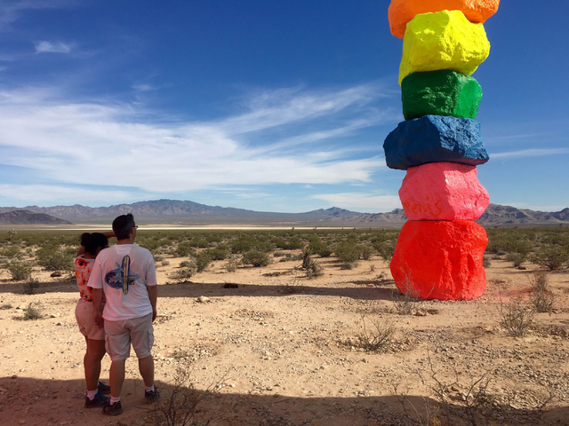 People take in the view of the towering rocks at the Seven Magic Mountains art project off Interstate 15 on Sunday, June 5, 2016.  (Natalie Bruzda/Las Vegas Review-Journal)
