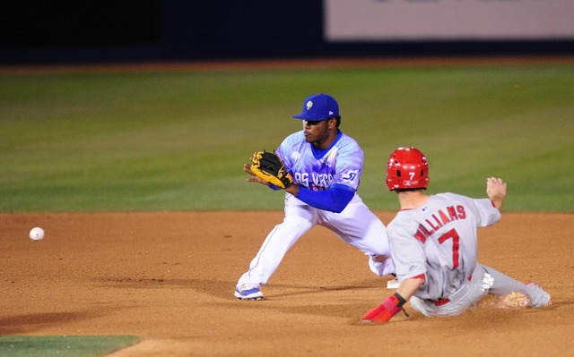 Las Vegas 51s second baseman Dilson Herrera tags out Memphis Redbirds base runner Matt Williams after Williams tried to steal second base in the seventh inning of their minor league baseball game ...