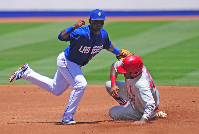 Memphis Redbirds base runner David Washington steals second base while Las Vegas 51s second baseman Dilson Herrera applies the tag in the first inning of their Triple-A minor league baseball game  ...