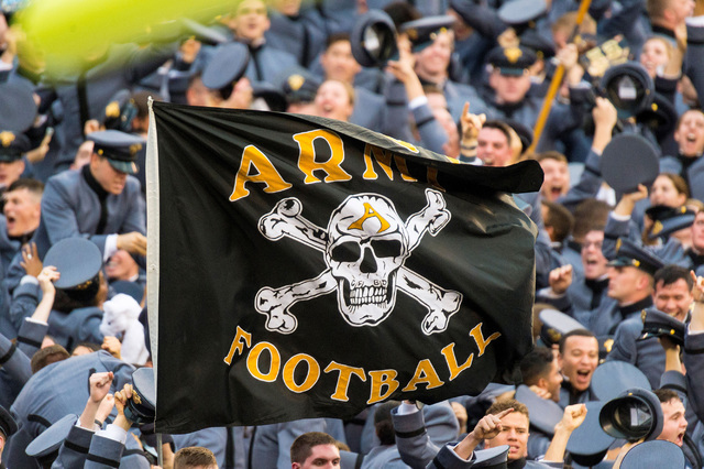 : The Army Black Knights flag waves proudly in front if the stands filled with cadets during the NCAA football game between the Army Black Knights and the Navy Midshipmen played at Lincoln Financi ...