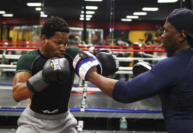 Shawn Porter, left, trains with his father, Kenny Porter, at Porter Hy-Performance Center, 2206 Paradise Road, in Las Vegas on Wednesday, June 8, 2016. Porter is slated to fight Keith Thurman on J ...