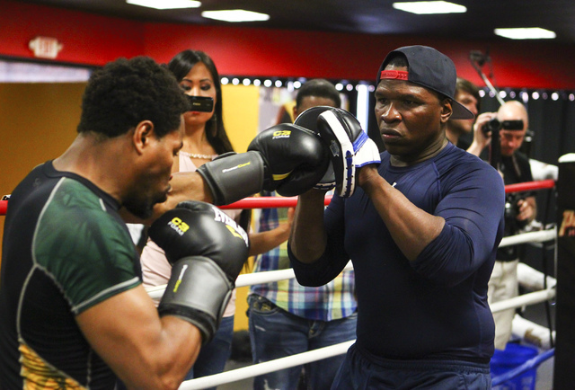 Shawn Porter, left, trains with his father, Kenny Porter, at Porter Hy-Performance Center, 2206 Paradise Road, in Las Vegas on Wednesday, June 8, 2016. Porter is slated to fight Keith Thurman on J ...