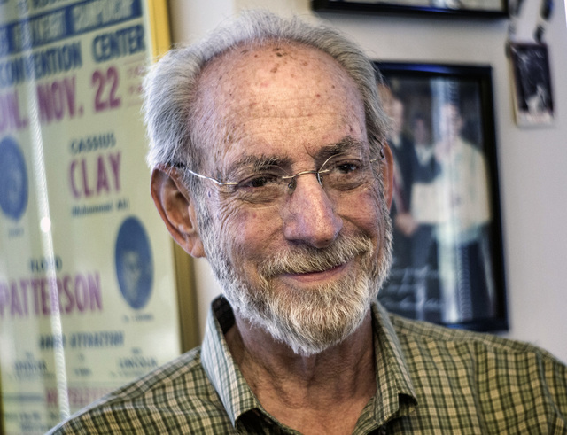 Marc Ratner, vice president of regulatory affairs with the Ultimate Fighting Championship and former executive director of the Nevada State Athletic Commission, poises in front of boxing memorabil ...