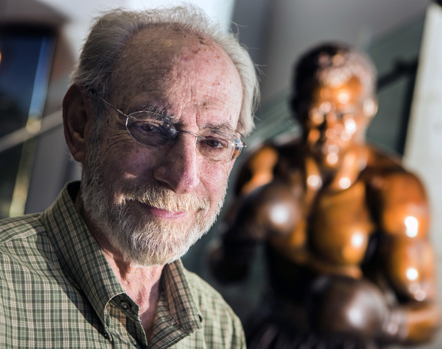 Marc Ratner, vice president of regulatory affairs with the Ultimate Fighting Championship and former executive director of the Nevada State Athletic Commission, poises in front of a statue of boxe ...