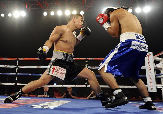 Las Vegas boxer Jesus Gutierrez, left, fights Pablo Becerra in the first round of their lightweight bout at the Tropicana Hotel Pavilion in Las Vegas Saturday, May 31, 2014. (Josh Holmberg/Las Veg ...