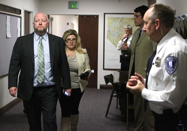 Legislative Counsel Bureau Director Rick Combs and Assemblywoman Michele Fiore, R-Las Vegas, walk to the Assembly chambers at the Legislative Building in Carson City, Nev., on Thursday, May 21, 20 ...