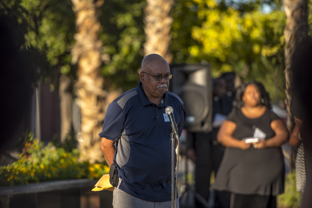 Bilal Shabazz speaks during an anniversary prayer vigil for the victims of the Charleston church shooting at the corner of Martin Luther King Boulevard and West Carey Avenue on Friday, June 17, 20 ...