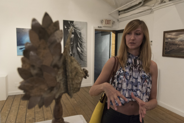 Artist Castille Ritter speaks with a reporter during the reception for "The Collective" art show at EDEN Art Studio and Gallery at The Arts Factory in Las Vegas Thursday, June 2, 2016. The show's  ...