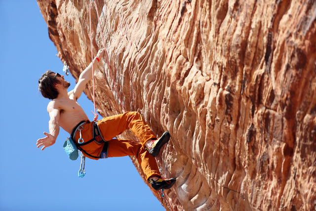 Professional rock climber Ethan Pringle, of San Francisco, lead climbs along the "New Wave Hookers" route at Calico Basin in Red Rock Canyon National Conservation Area Sunday, March 29, 2015, near ...