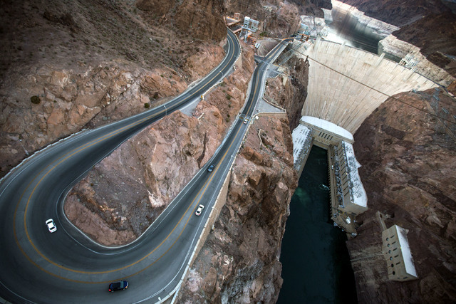 Light traffic is seen on the access road to Hoover Dam in this June 5 photo taken from the dam bypass bridge. Paid visitation has been declining at the iconic structure, though it still draws hund ...