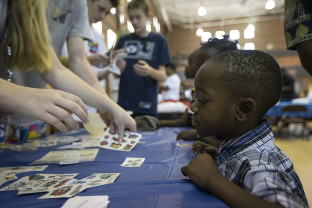 Victor Dusabe, 3, a refugee from the Democratic Republic of the Congo, attends a Catholic Charities World Refugee Day fair with his family at Our Lady of Las Vegas Roman Catholic Church. (Erik Ver ...