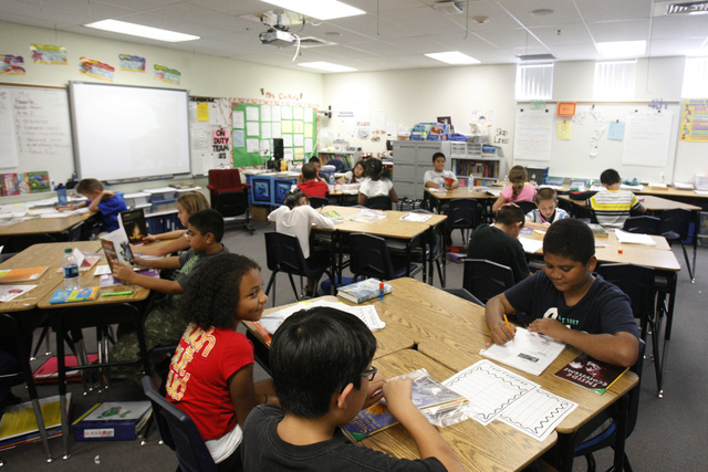 Fifth grade students read books inside their classroom at Wright Elementary School in Las Vegas Friday, Sept. 19, 2014.  (Erik Verduzco/Las Vegas Review-Journal)