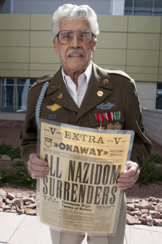 World War II veteran Milton Duran holds up the front page of the Onaway newspaper at the North Las Vegas VA Medical Center on Friday, June 3, 2016. (Loren Townsley/Las Vegas Review-Journal) Follow ...