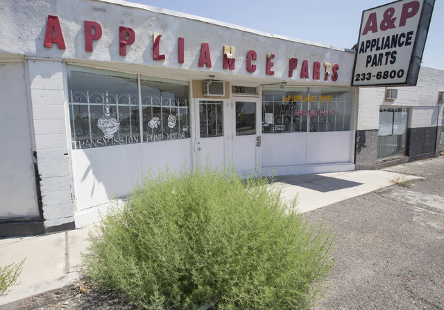 An oversized bush grows through the asphalt outside the A&P Appliance Parts store located at 310 East Lake Mead Blvd. in North Las Vegas on Thursday, June 23, 2016. (Richard Brian/Las Vegas Re ...