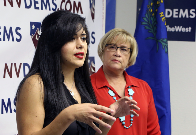 Attorney, Jessica Cruz, speaks as NVDEMS Chair Roberta Lange, right, looks on Monday, June 6, 2016, during a press conference to respond to Donald Trump's attacks accusing U.S. District Judge Gonz ...