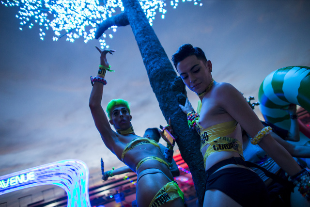 Jesse Fields, left, and Gustavo Luna, both of San Jose, Calif., dance during the first night of Electric Daisy Carnival at the Las Vegas Motor Speedway in Las Vegas on Friday, June 17, 2016. (Chas ...