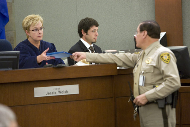 K.M. CANNON/LAS VEGAS REVIEW-JOURNAL
Judge Jessie Walsh, left, receives the verdict from bailiff Matt Diamond Wednesday, May 5, 2010, after a jury found two drug companies liable for the hepatitis ...