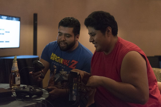 Felipe Sarmiento, left, and Angel Trejo compete in the Street Fighter V tournament at the Downtown Underground e-sports lounge at Downtown Grand hotel-casino in Las Vegas on Friday, June 3, 2016. ...