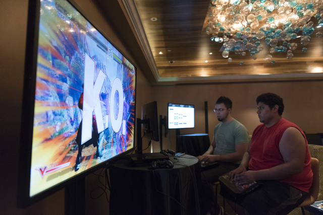 Edgar Briangas, left, and Angel Trejo compete in the Street Fighter V tournament at the Downtown Underground e-sports lounge at Downtown Grand hotel-casino in Las Vegas on Friday, June 3, 2016. Ja ...