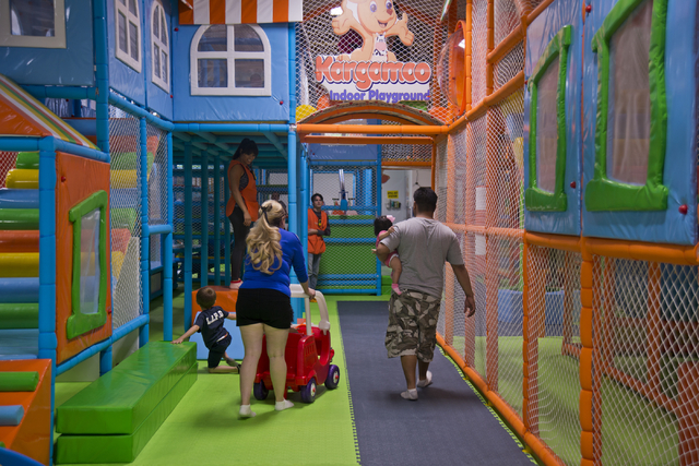A family walks together inside Kangamoo Indoor Playground May 27, 2016. Daniel Clark/View