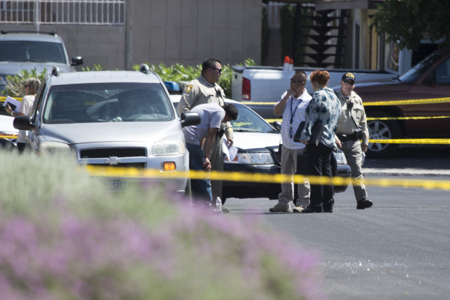 The scene of a shooting near Tonopah Drive and Washington Avenue is seen on Wednesday, June 1, 2016, in Las Vegas. Erik Verduzco/Las Vegas Review-Journal Follow @Erik_Verduzco