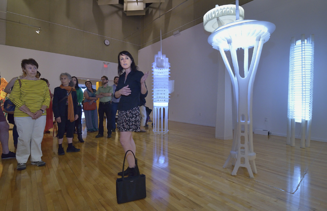 Flanked by her sculptures, former UNLV artist-in-residence Deborah Aschheim (cq), right, talks about her work at UNLV's Barrick Museum during the recent opening of "Five." Bill Hughes/Las Vegas Re ...