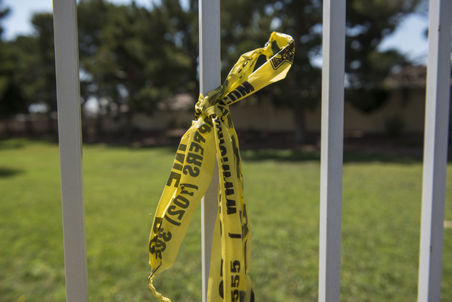 Crime scene tape is seen at Torrey Pines Condominiums in Las Vegas on Thursday, June 30, 2016. Three children were found shot dead in a unit Wednesday night. Police said a man killed his wife near ...
