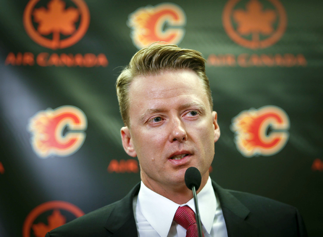 Calgary Flames new head coach Glen Gulutzan speaks during an NHL hockey news conference in Calgary, Alberta, Friday, June 17, 2016. (Jeff McIntosh/The Canadian Press via AP)
