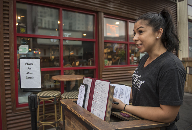 Renee Mashore, an employee at Le Thai restaurant, talks about the weather at the Fremont Street Experience in Las Vegas on Thursday, June 30, 2016. (Martin S. Fuentes/Las Vegas Review-Journal)