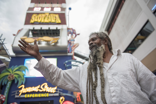 Busker Clyde Williams talks about the weather at the Fremont Street Experience in Las Vegas on Thursday, June 30, 2016. (Martin S. Fuentes/Las Vegas Review-Journal)