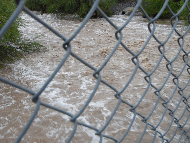 Flood water in Pittman Wash flows under Green Valley Parkway in Henderson Thursday, June 30, 2015. Natalie Burt/Special to the Las Vegas Review-Journal