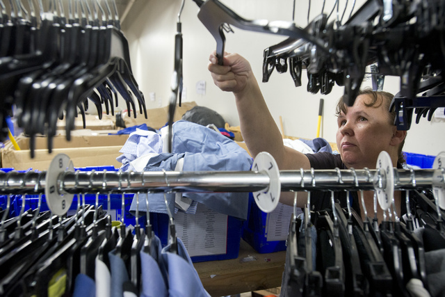 Employee Frankee Adam sorts clothes at the Goodwill Retail and Donation Center at Boulevard Mall in Las Vegas on May 31, 2016. Bridget Bennett/Las Vegas Review-Journal Follow @bridgetkbennett