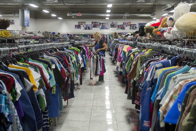 Employee Rhonda Kellaway puts clothes on the racks at the Goodwill Retail and Donation Center at Boulevard Mall in Las Vegas on May 31, 2016. Bridget Bennett/Las Vegas Review-Journal Follow @bridg ...