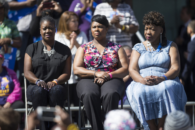 Women whose sons were killed by law enforcement from left, Sybrina Fulton, mother of Trayvon Martin, Wanda Johnson, mother of Oscar Grant, and Gwen Carr, mother of Eric Garner, sit on stage during ...