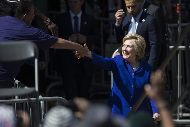 Democratic presidential candidate Hillary Clinton walks to the stage for a campaign rally at Leimert Park Village Plaza on Monday, June 6, 2016, in Los Angeles, Calif. Erik Verduzco/Las Vegas Revi ...
