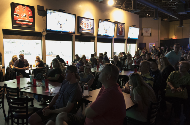 Hockey fans gather at Brooksy's Bar & Grill prior to a conference in which the NHL's Board of Governors announced approval of an expansion franchise in Las Vegas Wednesday, June 22, 2016. Jaso ...