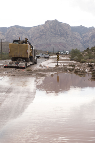 Crews on state Route 159 just south of Bonnie Springs in Red Rock Canyon National Conservation Area work to reopen the highway which was closed due to a washout Thursday, June 30, 2016. (Jason Ogu ...