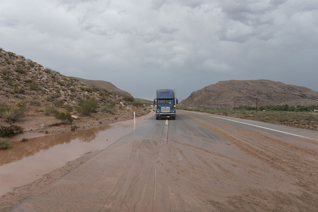 A big rig waits on state Route 159 just south of Bonnie Springs in Red Rock Canyon National Conservation Area as crews work to reopen a road washout Thursday, June 30, 2016. (Jason Ogulnik/Las Veg ...