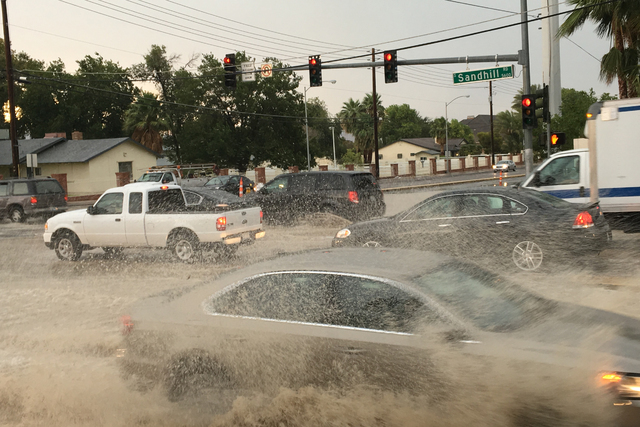 Flooded streets are seen at Sandhill Road and Russell Road in Las Vegas on June 30, 2016. (Bizuayehu Tesfaye/Las Vegas Review-Journal)