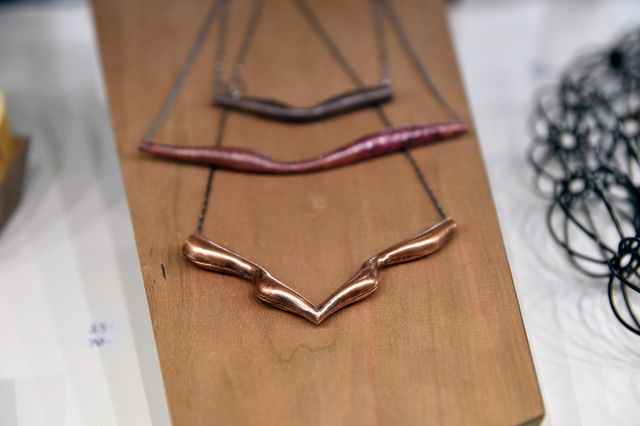 Necklaces made from copper are displayed at Katherine Dannenberg's booth at the JCK Las Vegas jewelry industry show at the Mandalay Bay Convention Center Friday, June 3, 2016, in Las Vegas. David  ...