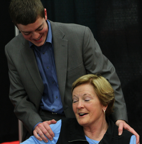Marquette assistant coach Tyler Summitt, with his mom, NCAA women's basketball coaching legend Pat Summitt, talk after the Golden Eagles defeated Tennessee Tech at the South Point Arena in Las Veg ...