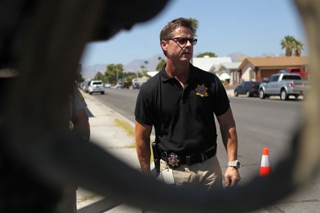 Las Vegas police Sgt. John Sheahan discusses an officer-involved shooting near the intersection of Alta Drive and Antelope Way on Sunday morning. (Erik Verduzco/Las Vegas Review-Journal)