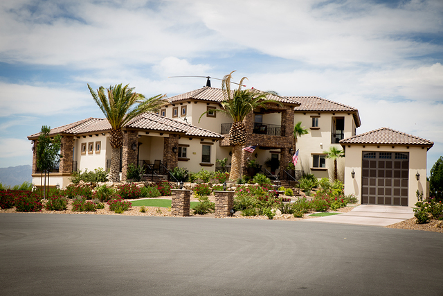 A Robinson R-44 helicopter is on the roof of John Morris’ nearly 5,000-sqaure-foot home at Spring Mountain Motor Resort & Country Club’s housing development, Spring Mountain Estates. Morri ...