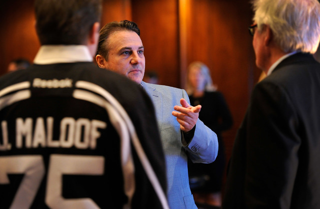 Gavin Maloof, center, speaks with his brother, Joe Maloof, left, and Bill Foley during a promotional stop to sell season hockey tickets at the Southern Highlands Golf Club on Monday, Feb. 23, 2015 ...