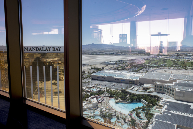 The windows at Delano's Skyfall lounge look out Friday over the solar power farm atop the convention center at Mandalay Bay, which now ranks as the largest rooftop array in the nation. (Bridget Be ...