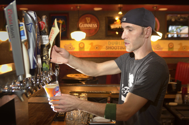 Bartender John Hilden pulls a beer at McFadden's Restaurant and Saloon in Town Square at 6593 Las Vegas Blvd. South in Las Vegas on Saturday, June 4, 2016. Bill Hughes/Las Vegas Review-Journal