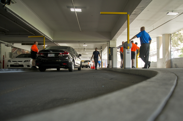 Staff help visitors on the first day of paid parking at the Monte Carlo hotel-casino parking garage on the Las Vegas Strip on Monday, June 6, 2016. Daniel Clark/Las Vegas Review-Journal Follow @Da ...