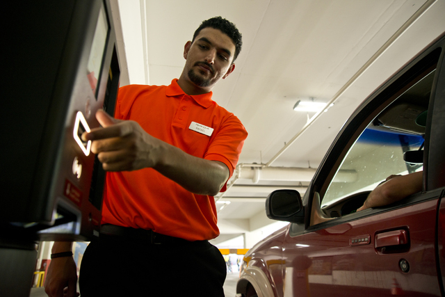 Rafael Lopez helps a visitor exit the parking garage on the first day of paid parking at the Monte Carlo hotel-casino parking garage on the Las Vegas Strip on Monday, June 6, 2016. Daniel Clark/La ...