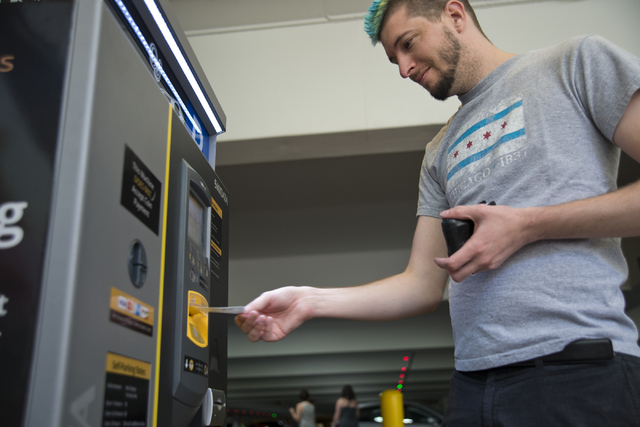 Haylen Jensen uses a kiosk to pay for his parking on the first day of paid parking at the Monte Carlo hotel-casino parking garage on the Las Vegas Strip on Monday, June 6, 2016. Daniel Clark/Las V ...